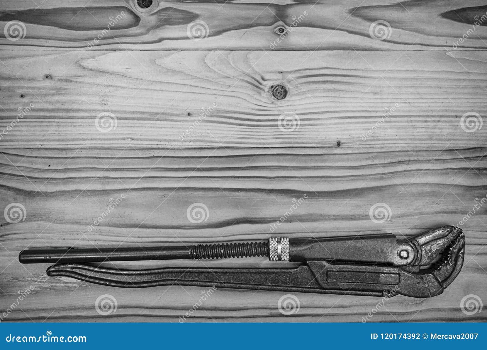 Pipe Wrench on a Wooden Table. Stock Photo Image of equipment, tool