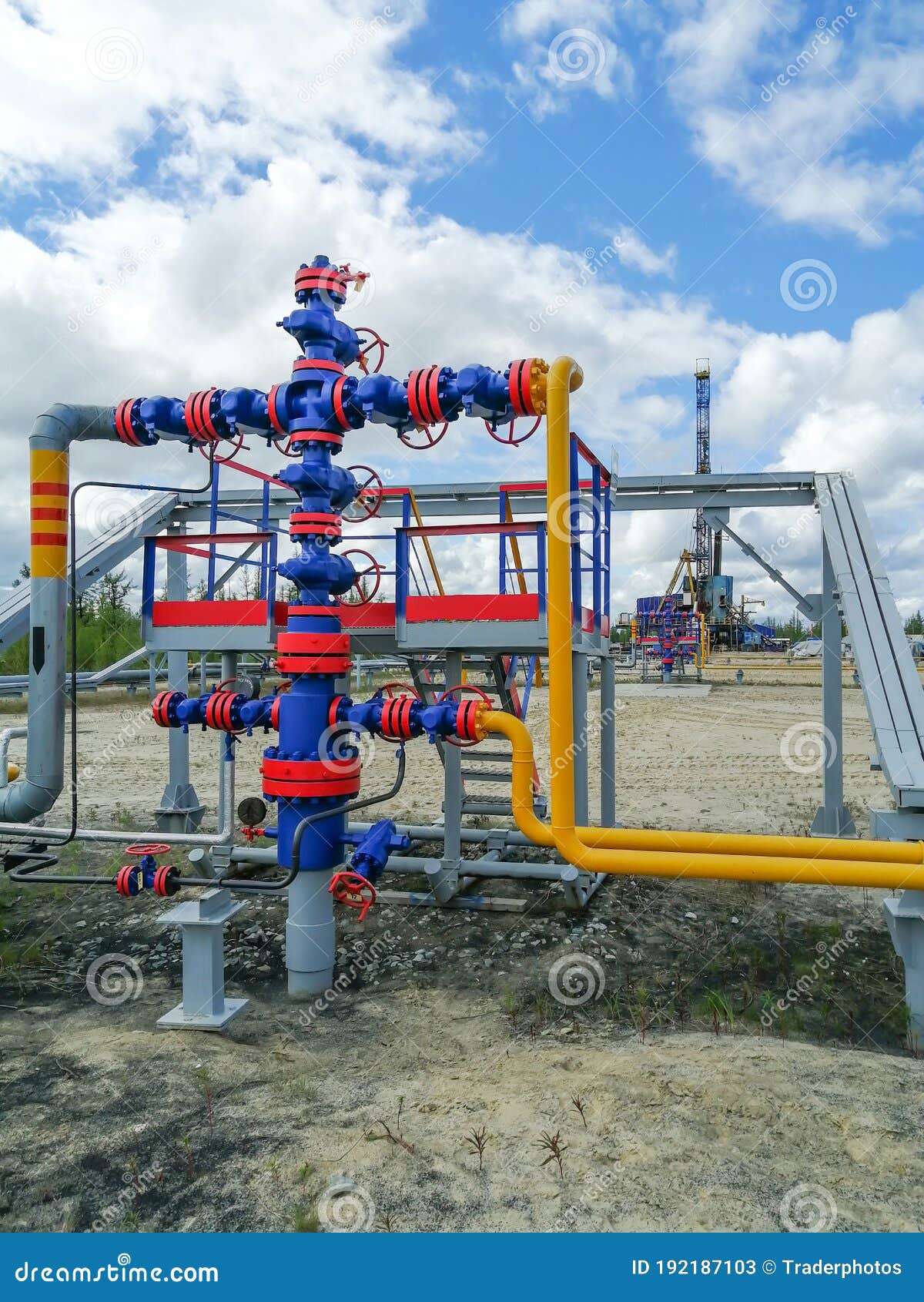 pipeline collector of gas wells on the background of the drilling rig.