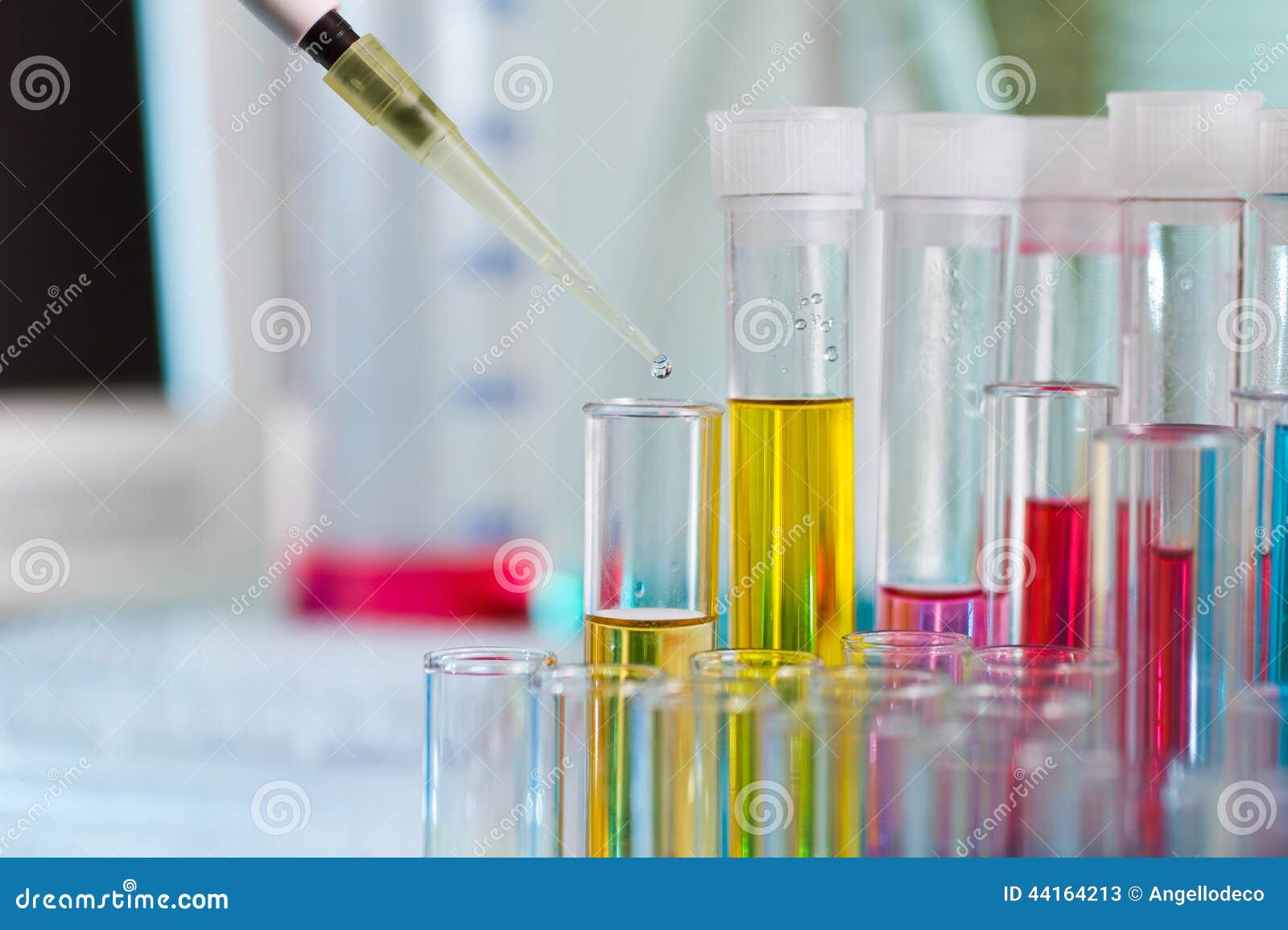 Pipette Dosing in Tubes with Equipment Laboratory in Workbench Stock
