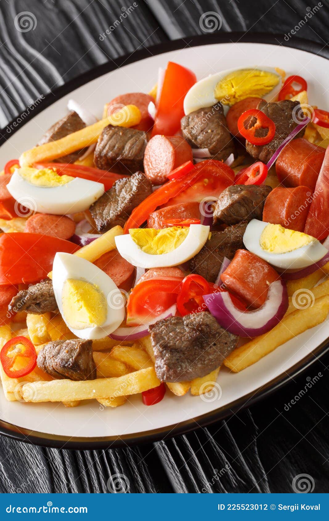 Pique Macho is a Very Popular Dish from Bolivia Made of Beef Cuts and Fried  Sausages with Fries, Eggs, Chili Peppers and Tomatoes Stock Photo - Image  of background, cuisine: 225523012