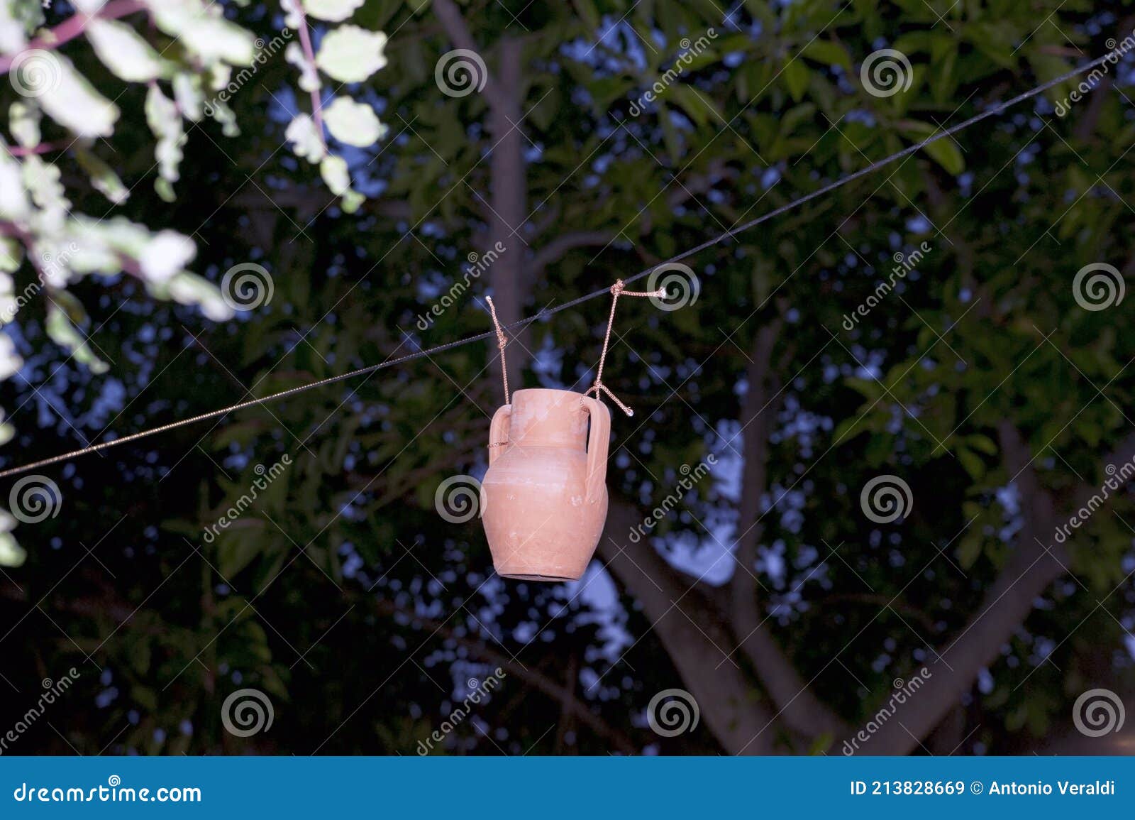 A Pitcher Hanging on a Rope in the Garden. Playful. Stock Image - Image of  countryside, break: 213828669