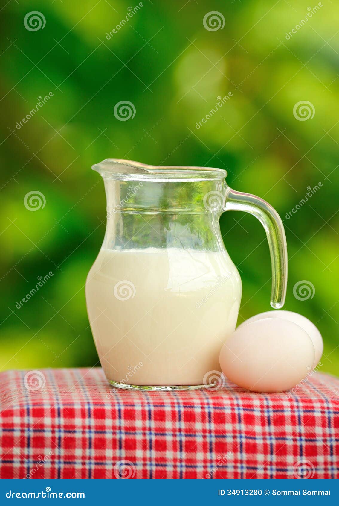 Pitcher of milk and eggs stock photo. Image of eggs, bakery 34913280