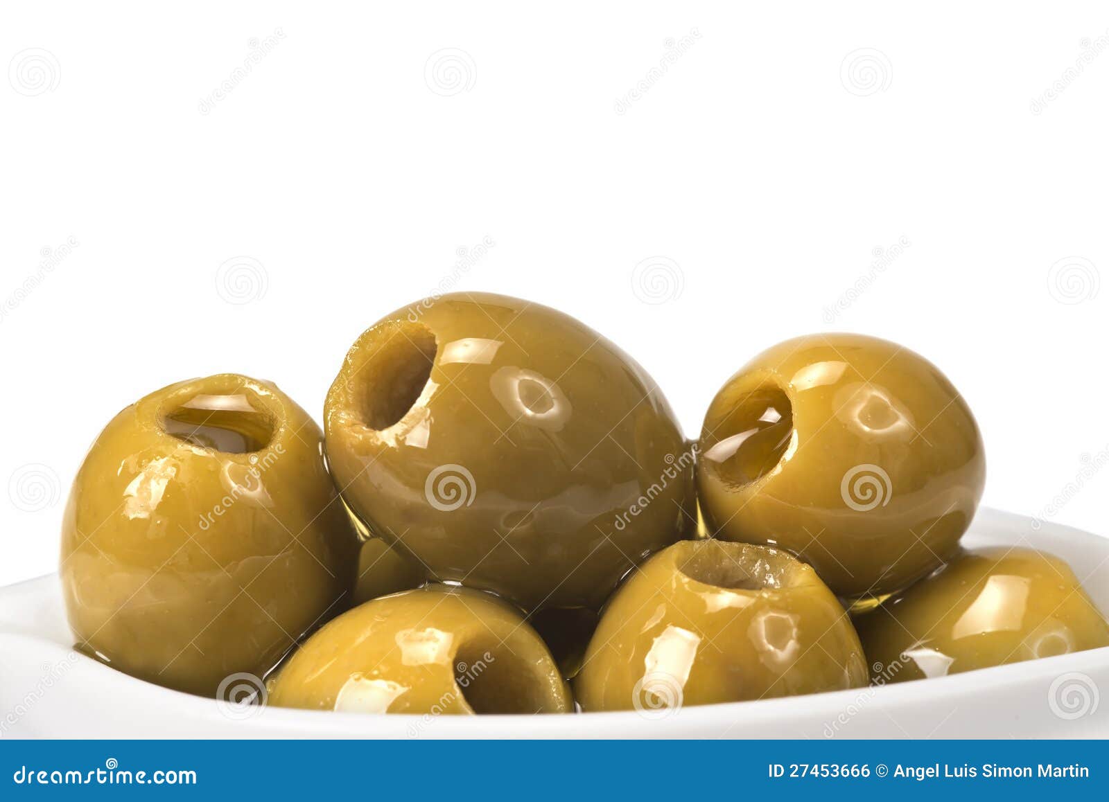 pitted olives on a white background