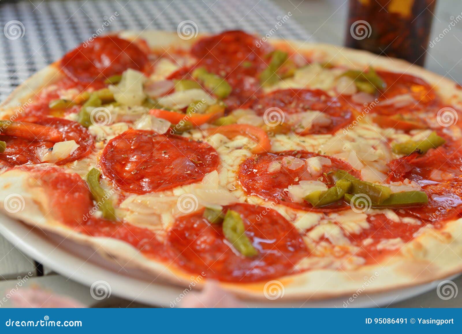 Pizza With Chorizo Sausage On A Wooden Board. Whole Pizza, One Piece
