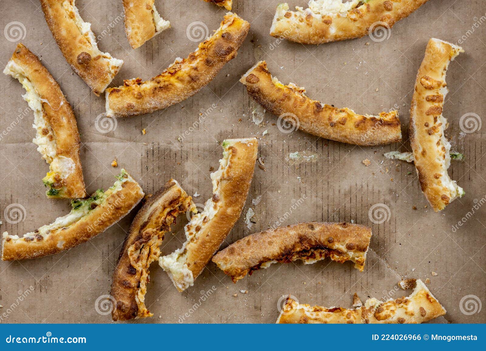 Pizza Crusts in a Greasy Box on a Home Table. Leftover Pieces of ...