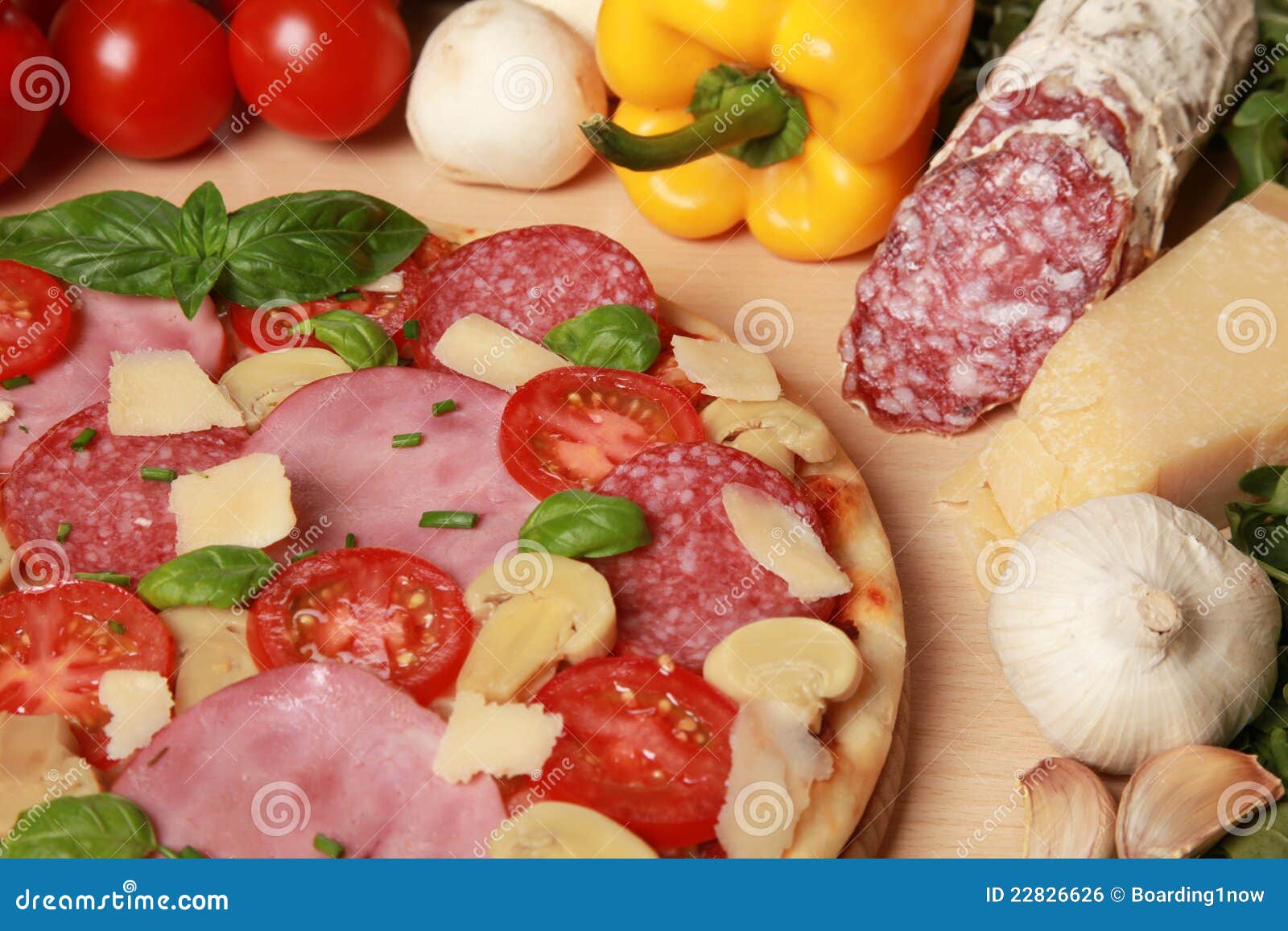 Pizza with ham and salami stock photo. Image of cheese 22826626