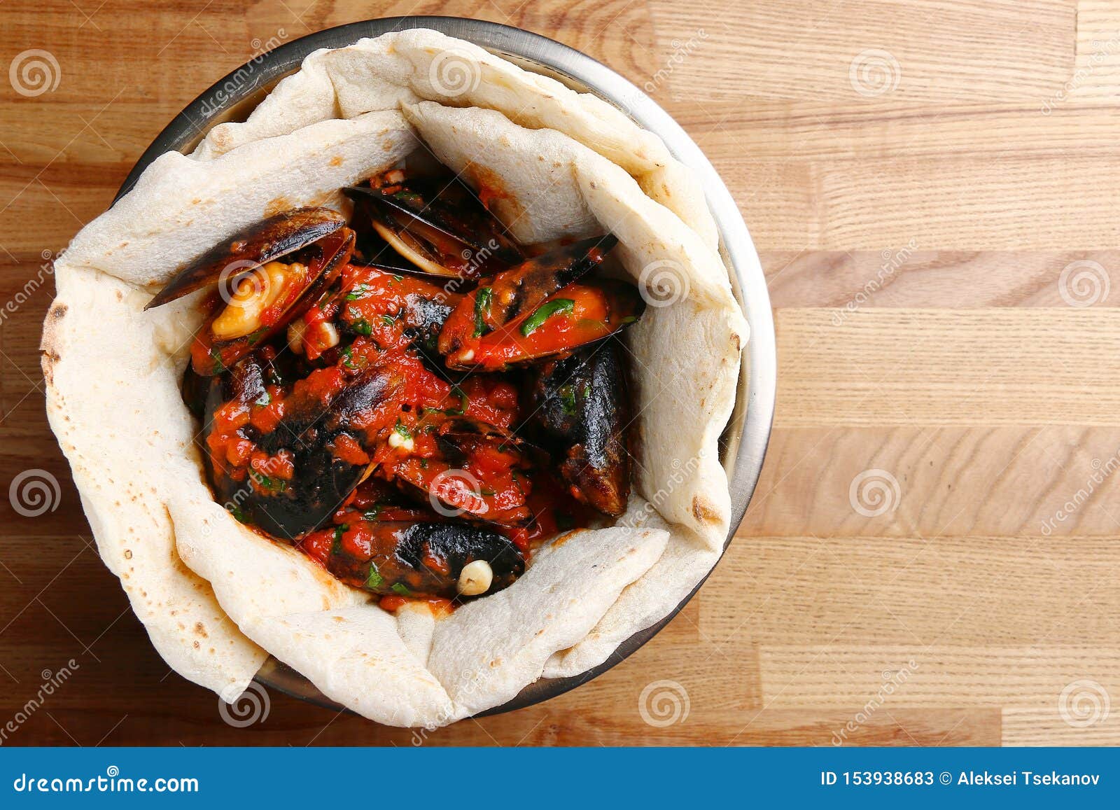 Pizza with Mussels on Table Restaurant Traditional Pizza with Basil