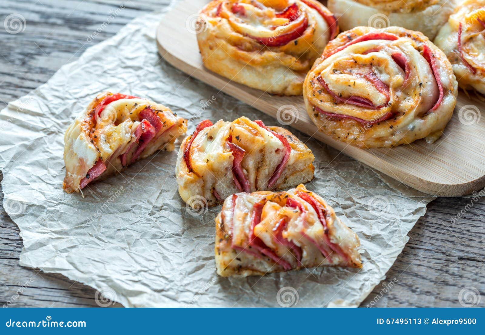 Pizza rolls on the wooden board close up