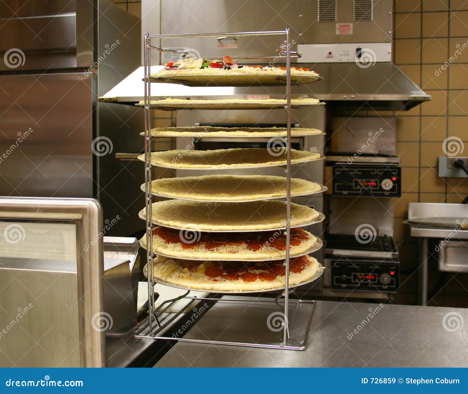 Pizzas in Rack (Focus on Pizzas) Stock Image Image of mozzerella