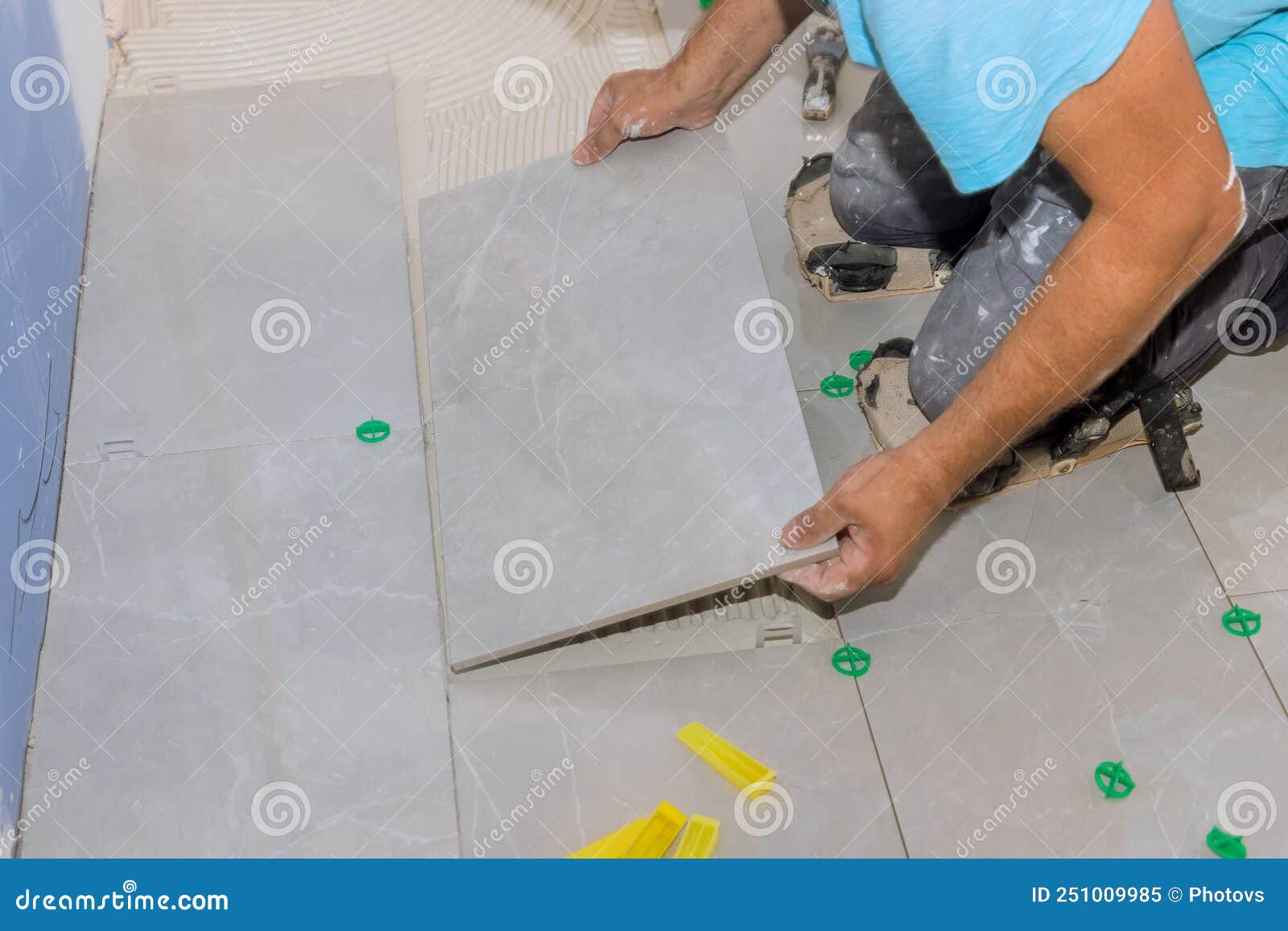 Placing Ceramic Tiles on Gluesmeared Floors Using Tile Adhesive Stock