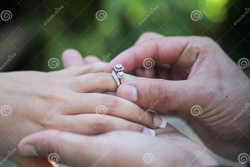Placing Wedding Ring on Finger Stock Photo Image of body, hand 27901626