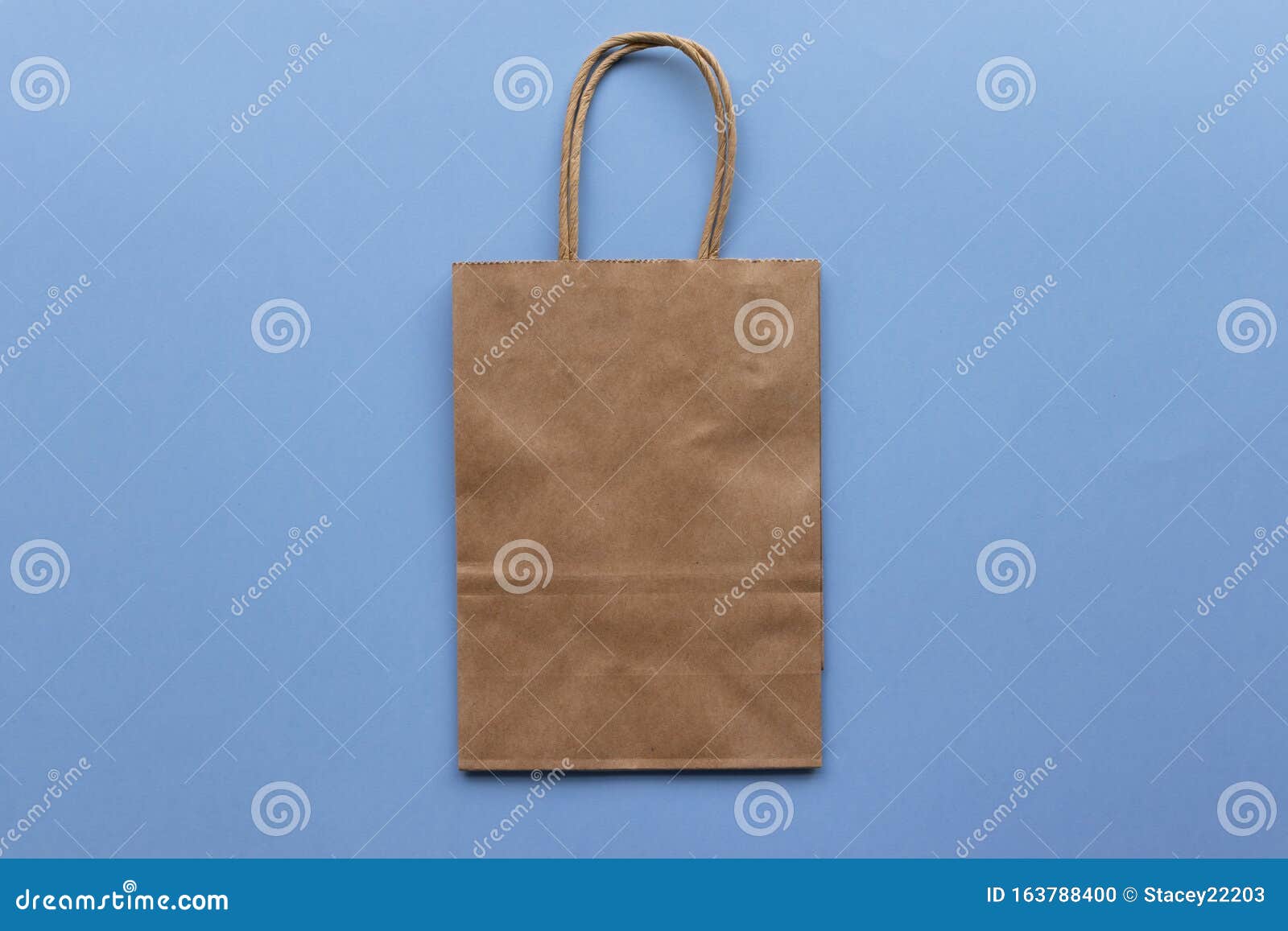 Download Plain Blank Brown Paper Bag On A Blue Background, Empty ...