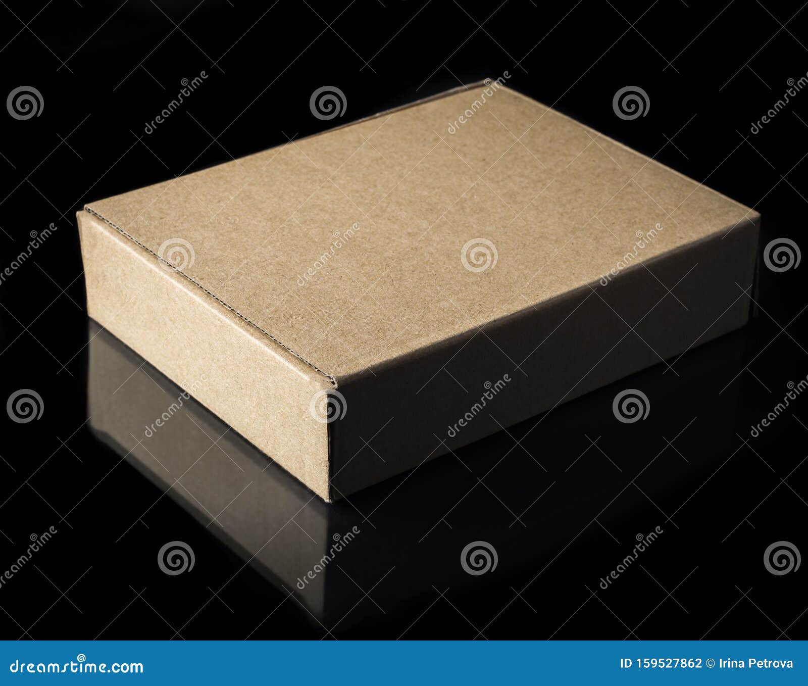 Plain Cardboard Box on Black Background with Reflection Stock Photo