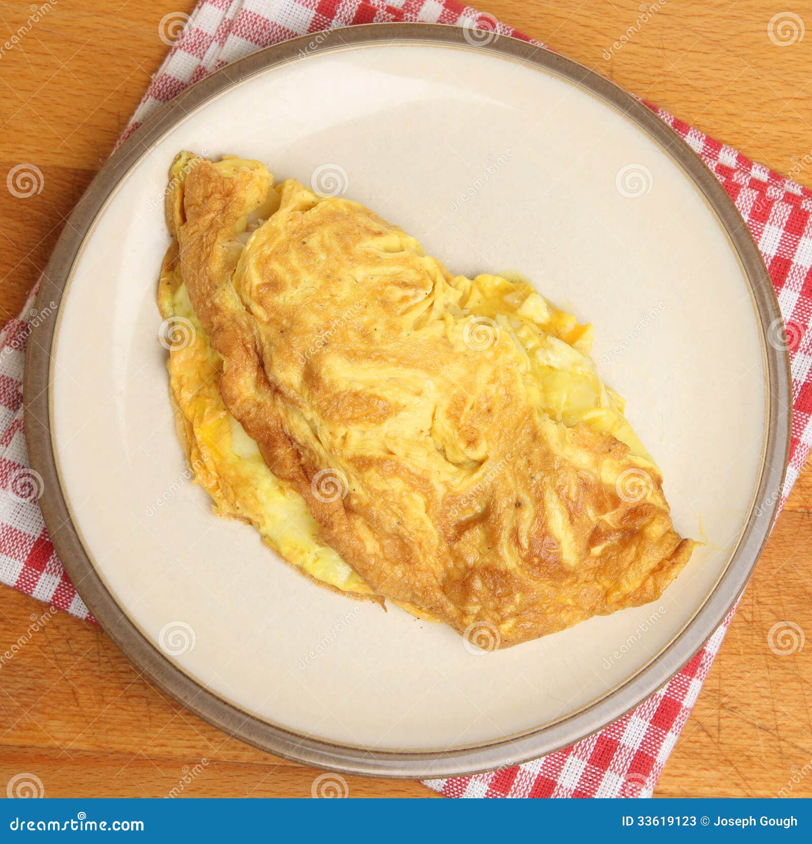 Making omelettes - folding over plain omelette using a large spatula Stock  Photo - Alamy