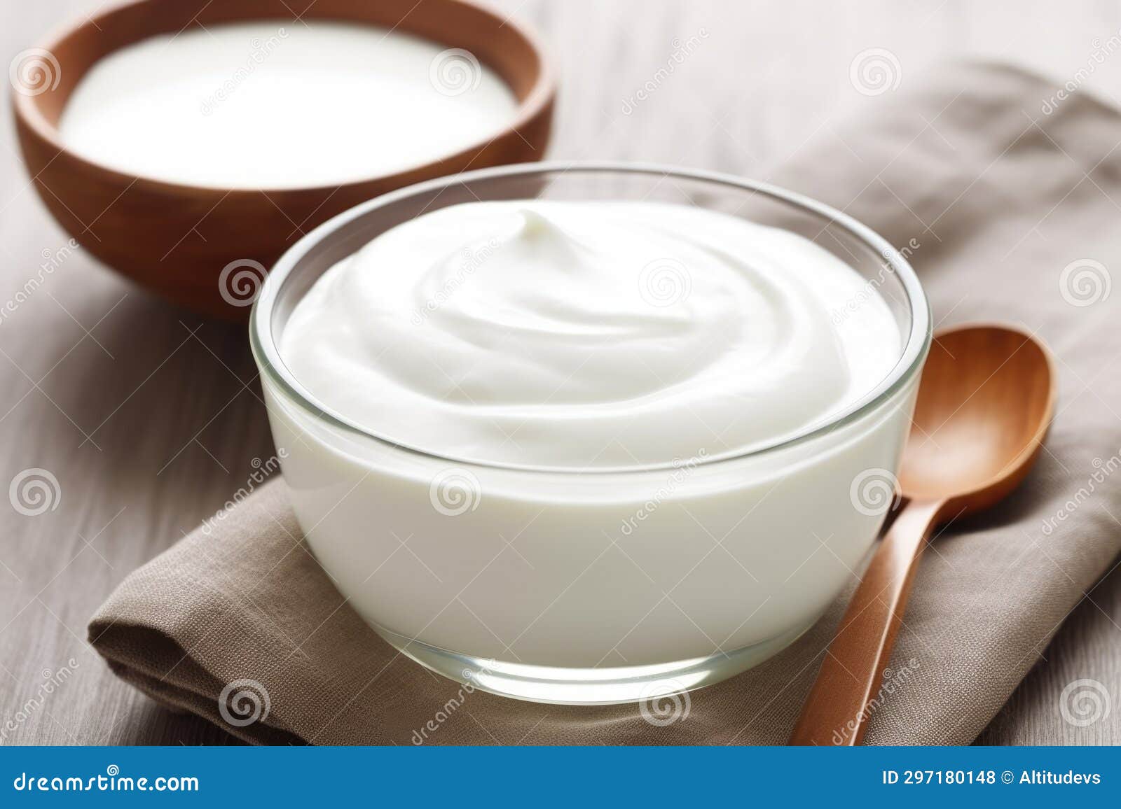 Plain Yogurt in a Ceramic Bowl with a Silver Spoon Stock Photo Image