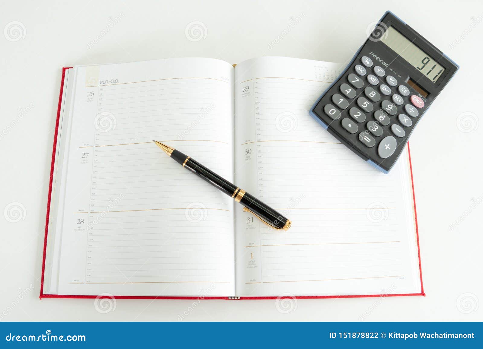 Daily Plan Book Spread Out with a Fountain Pen and Calculator on it
