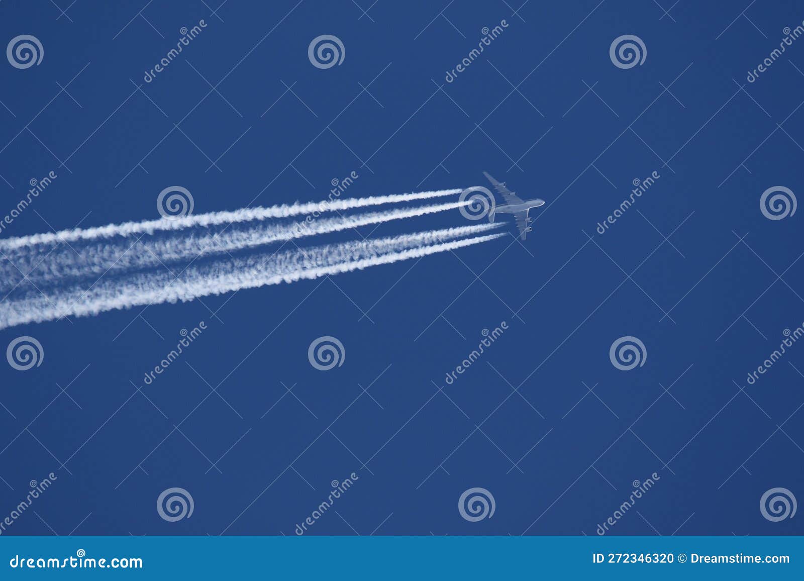 A Plane and Vapor Trails in the Sky Stock Photo Image of pollution