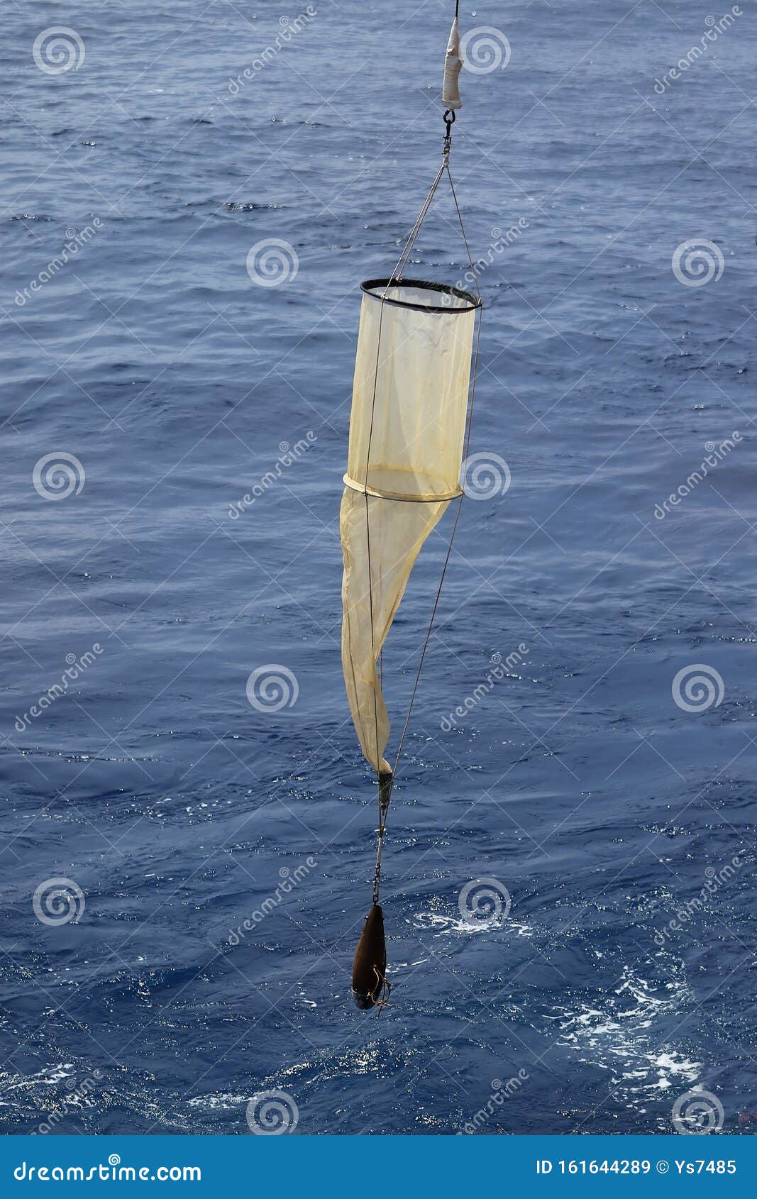 Plankton Net on the Blue Water Background. Science Equipment for