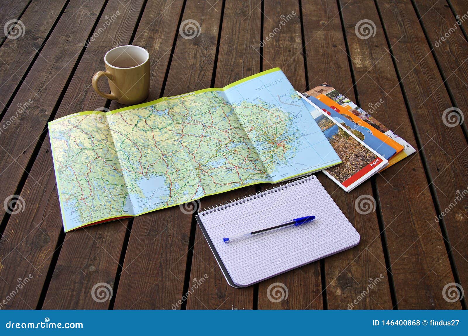 planning a holiday with road maps.