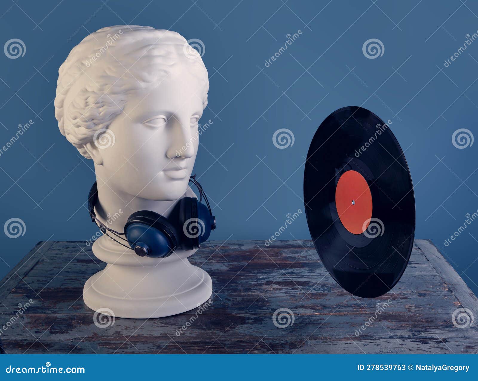 Plaster Bust of a Graceful Aphrodite with Huge Blue Audio Wireless  Headphones Looking at a Black Vinyl Record. Stock Image - Image of bust,  collection: 278539763