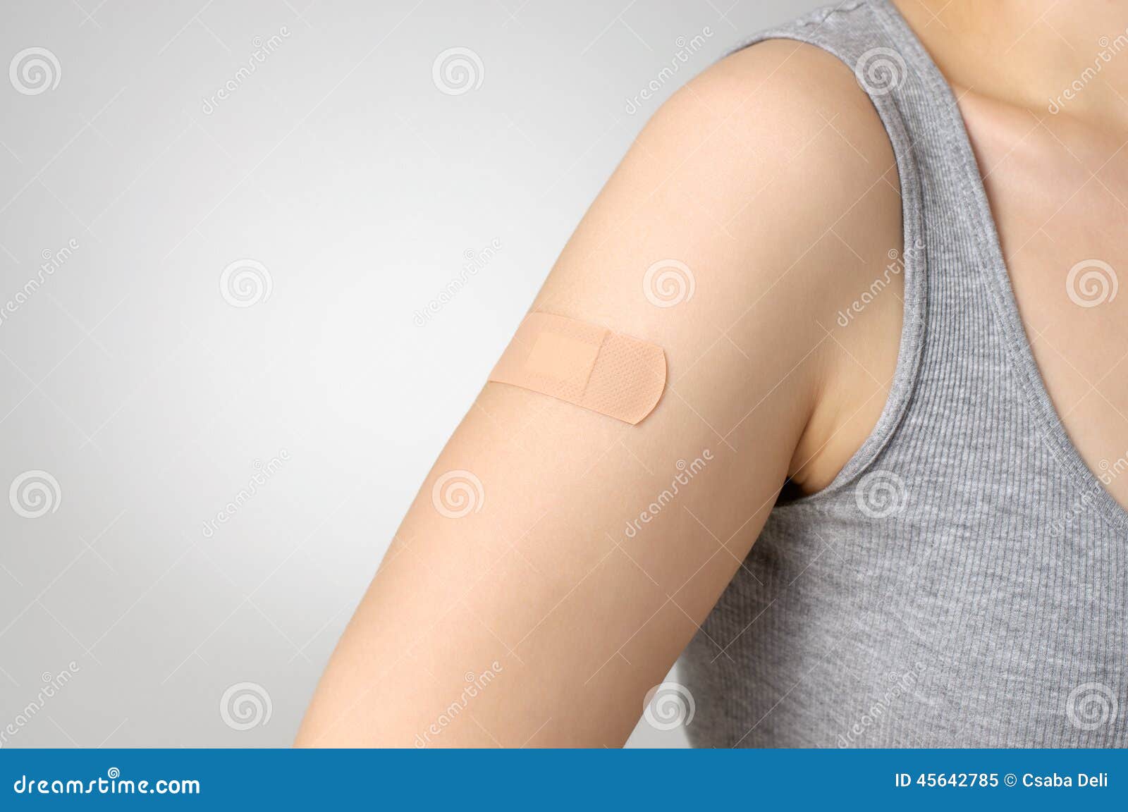 plaster on female arm