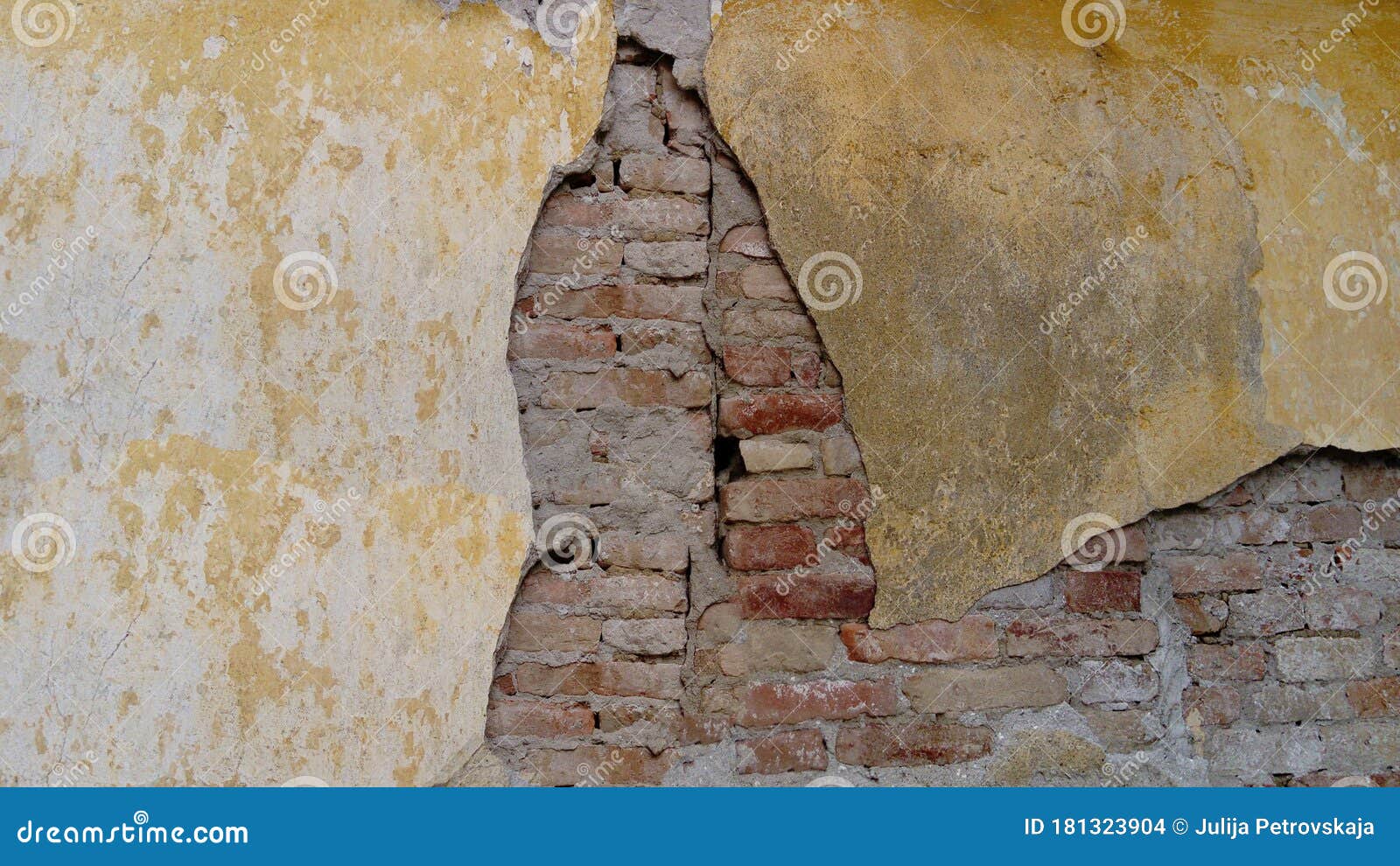 Plaster Peeling Off Brick Wall. Old Worn Down Brick Wall with Plaster