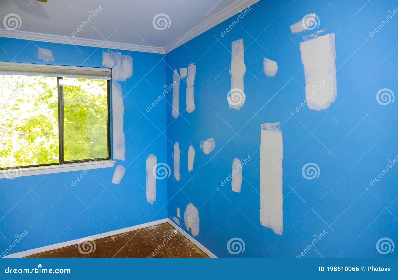 Plasterer Plastering Wall of Drywall at a Construction Damaged Wall