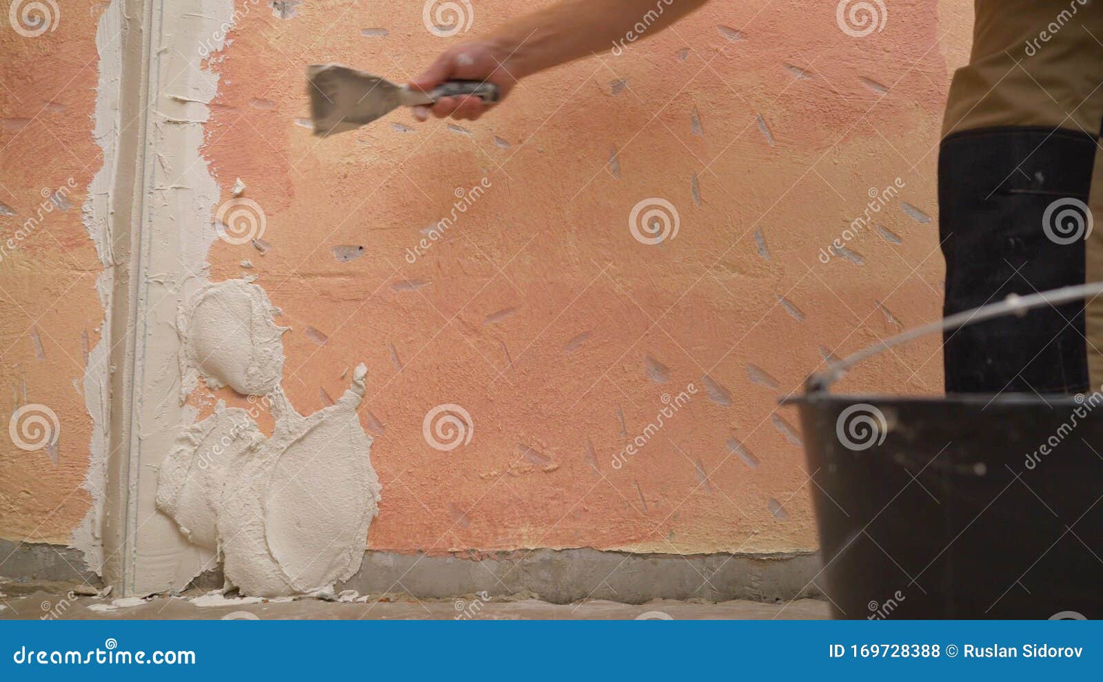 Plasterer Putting Plaster on Wall. Putting Plaster on the Wall. Stucco