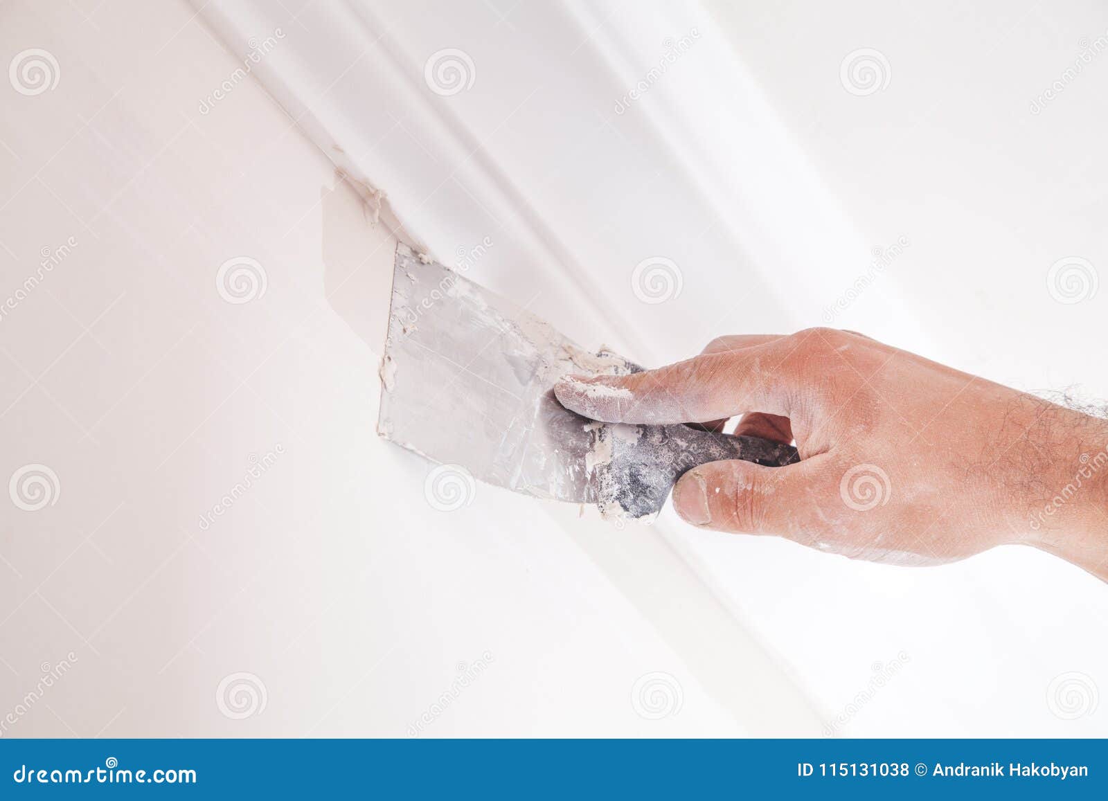 plastering wall with spatula.