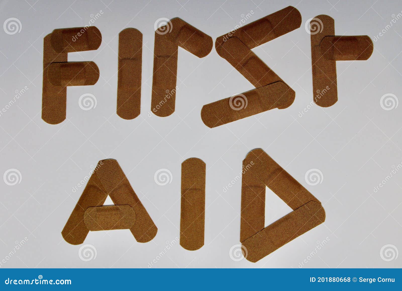 Plasters Spelling the Words First Aid Stock Photo Image of white