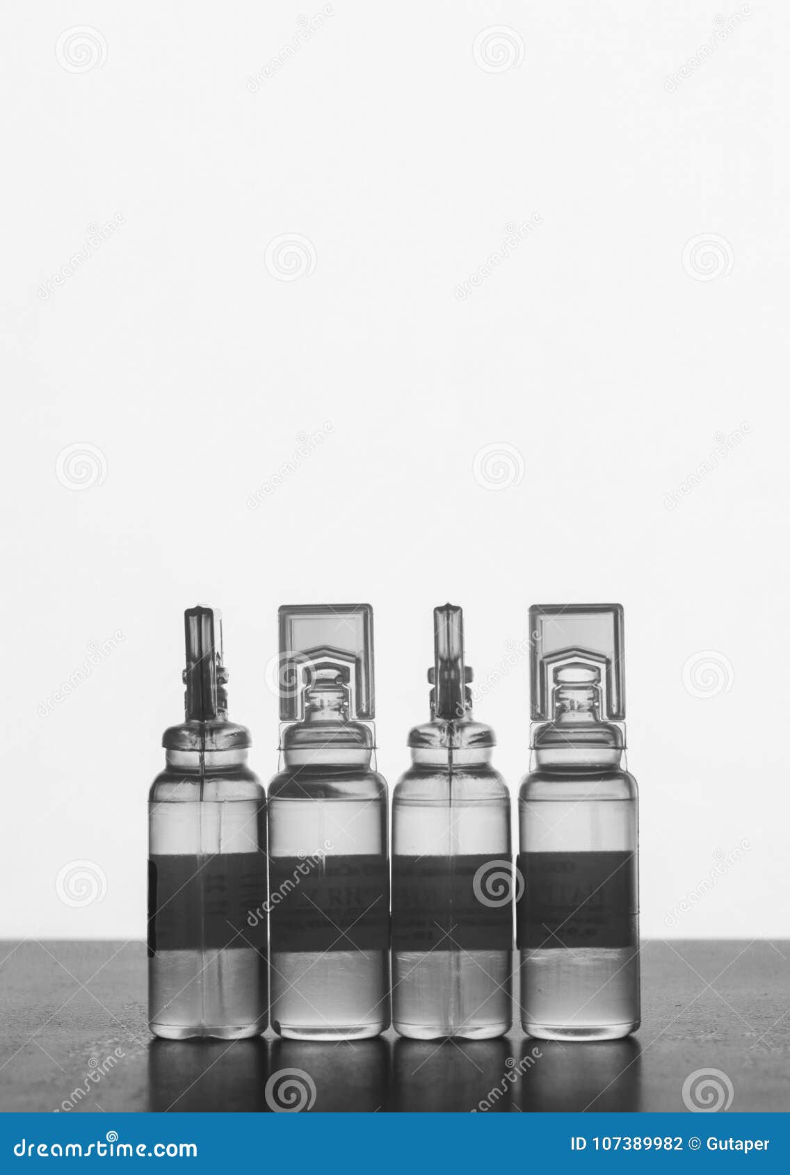 Plastic Ampoules With Solution For Injections On A Gray Background