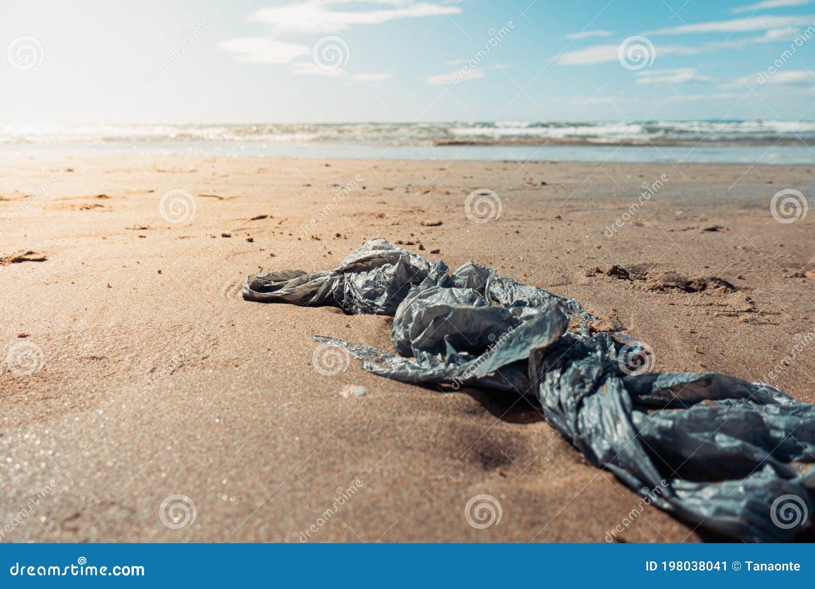 Plastic Bag on a Beach, Tourism and Environment Concept. Stock Image