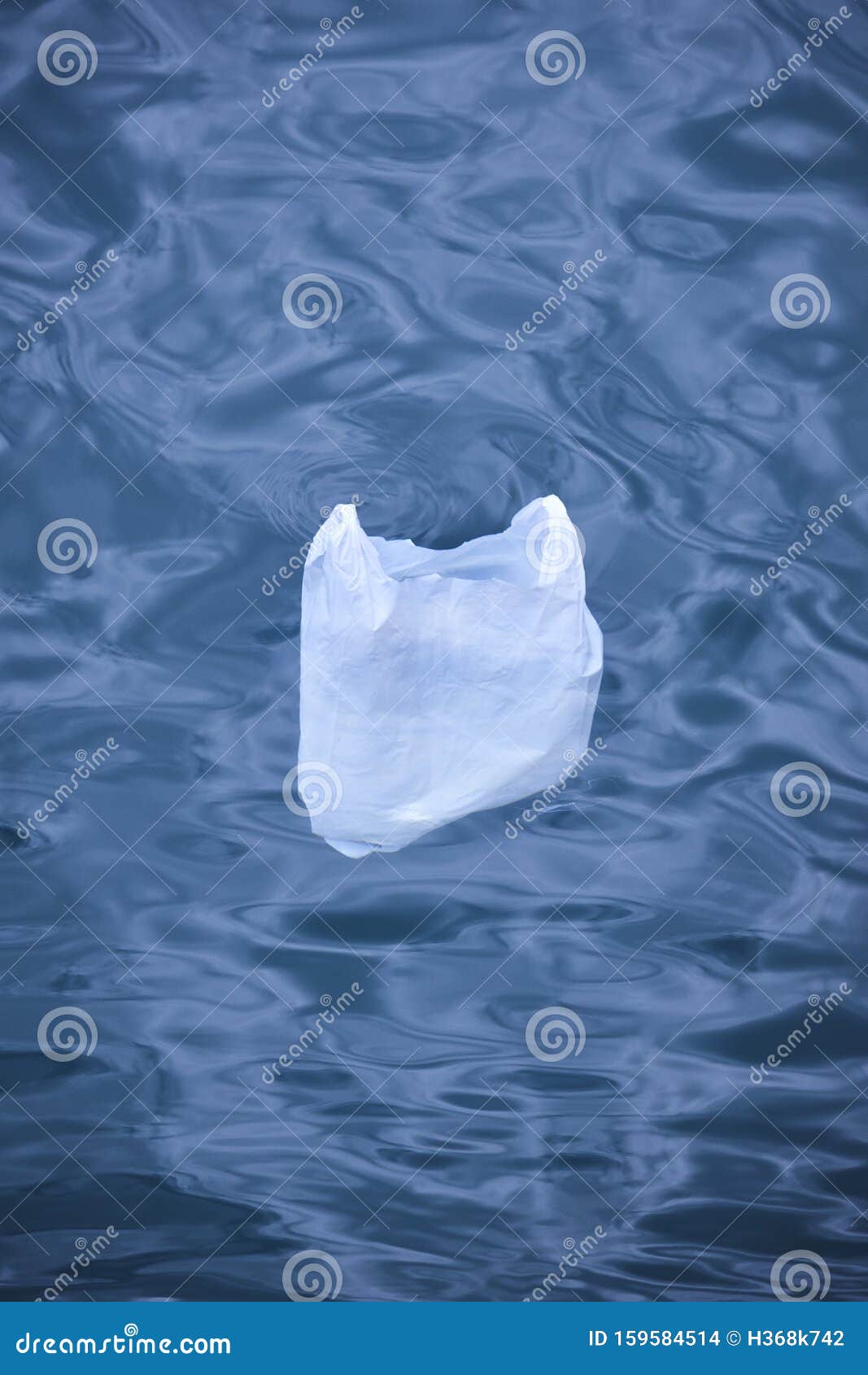 Plastic Bag Floating into the Sea. Environmental Damage Pollution