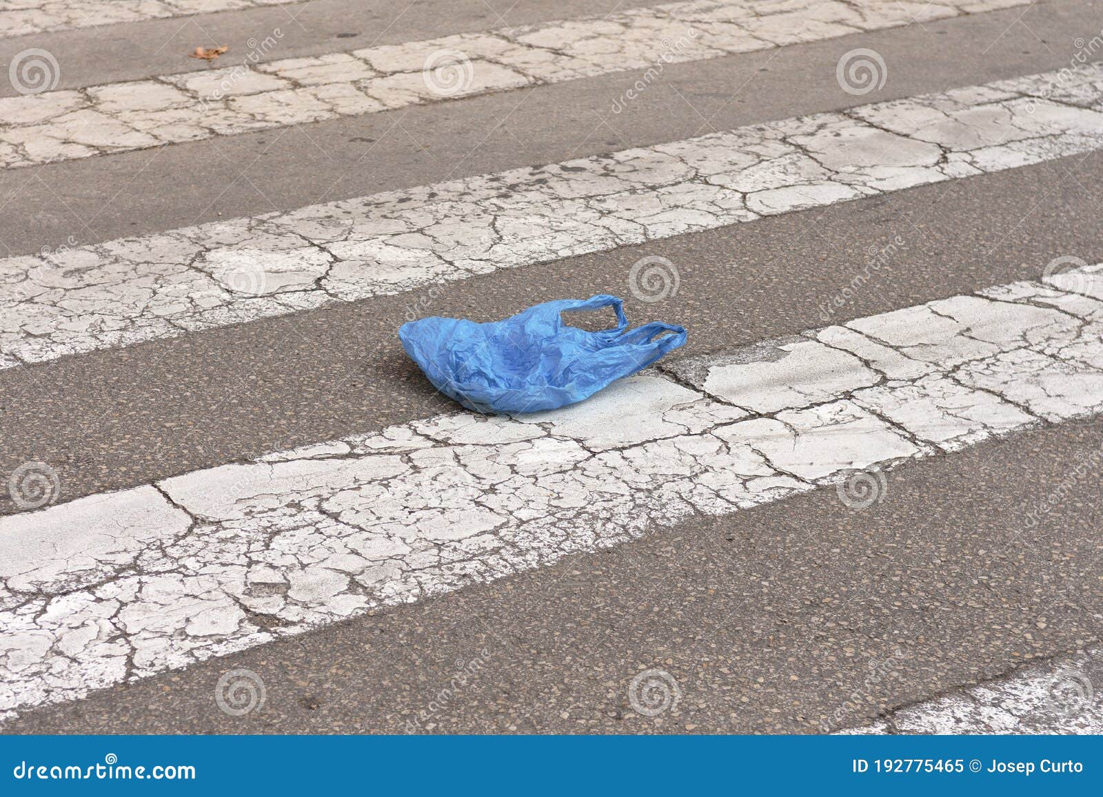 A plastic bag in a street stock image. Image of object 192775465