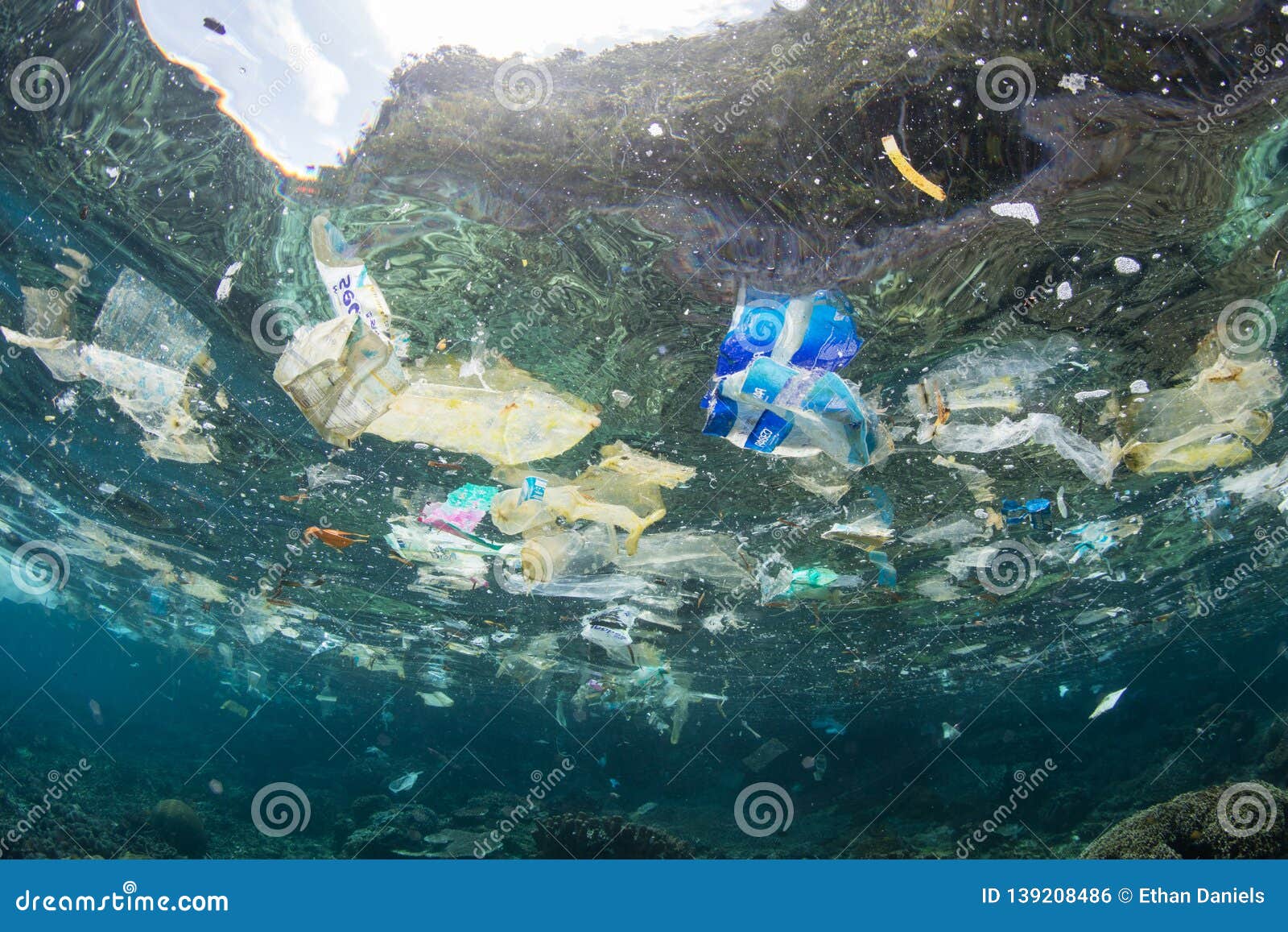 plastic bags and garbage in tropical pacific ocean