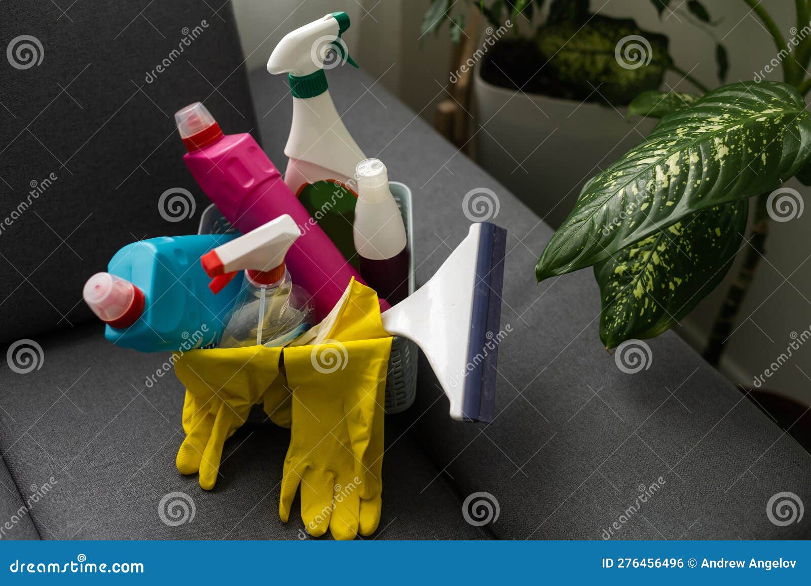 Plastic Basket Full of Cleaning Supplies and Equipment Stock Photo