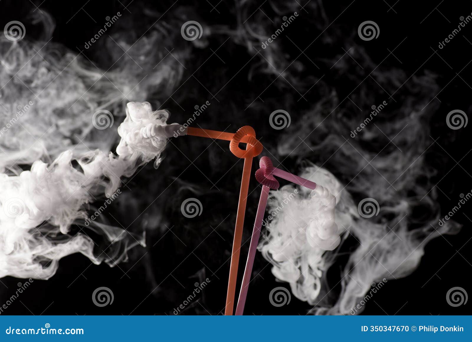 plastic bio degradable straws with mist shooting from straws creating unique patterns