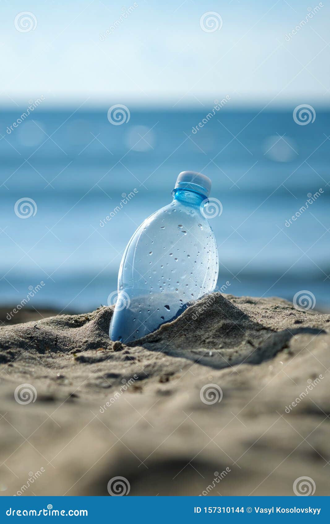 Plastic Bottle Is On The Beach Leave By Tourist. The Problem Of