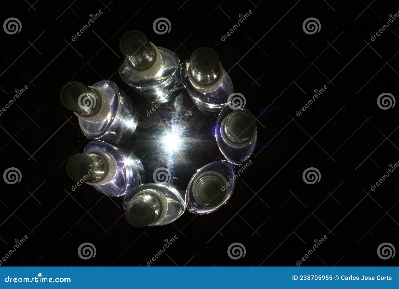 plastic bottle containers in a circle of light