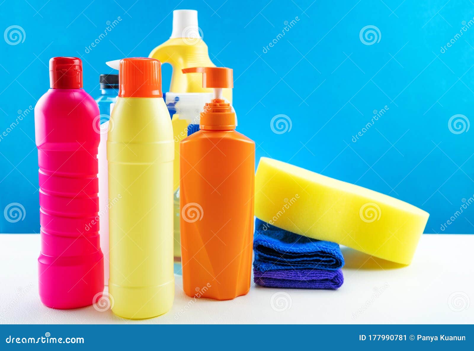Plastic Bottles of Cleaning Products Set on White Table Stock Image
