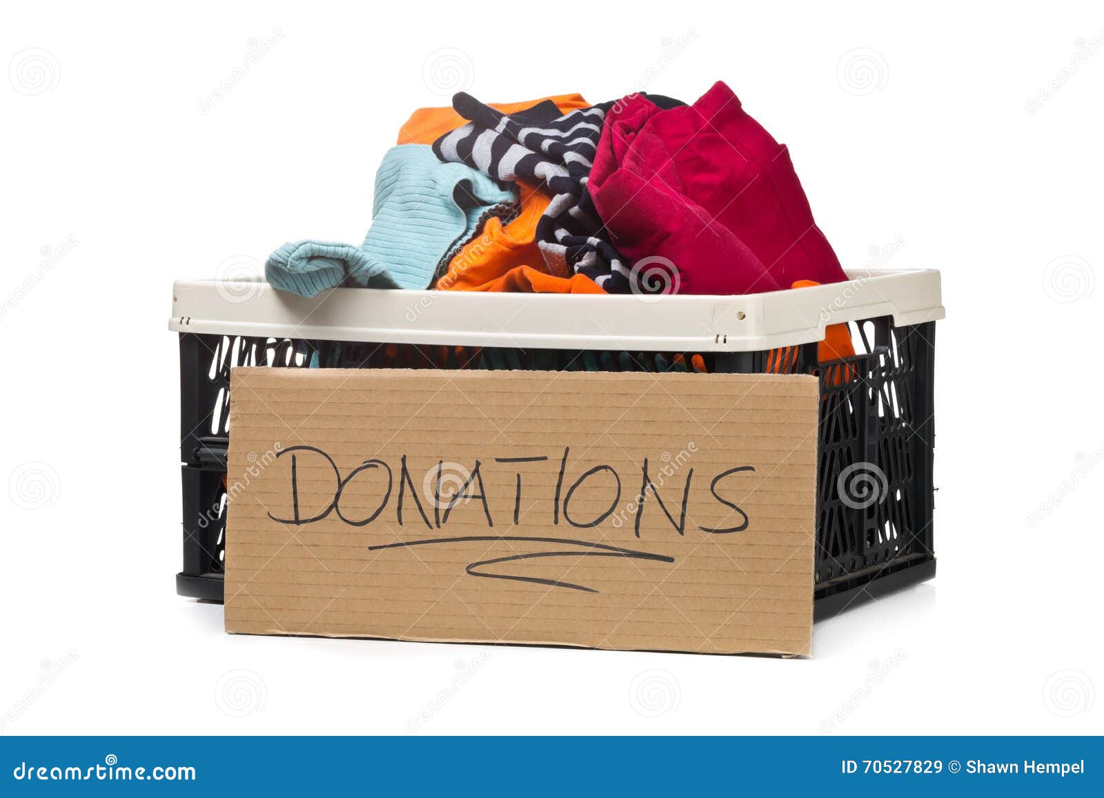 plastic box with clothing donations and cardboard sign