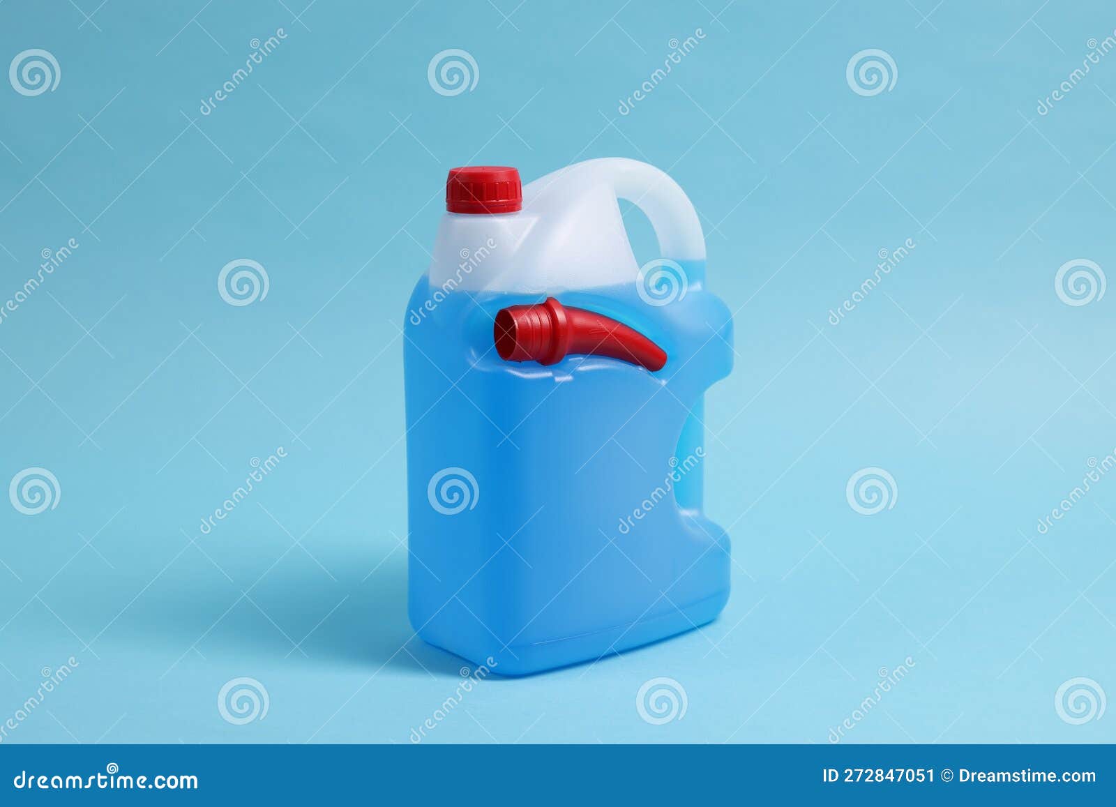 Plastic Canister with Color Liquid on Light Blue Background Stock Image