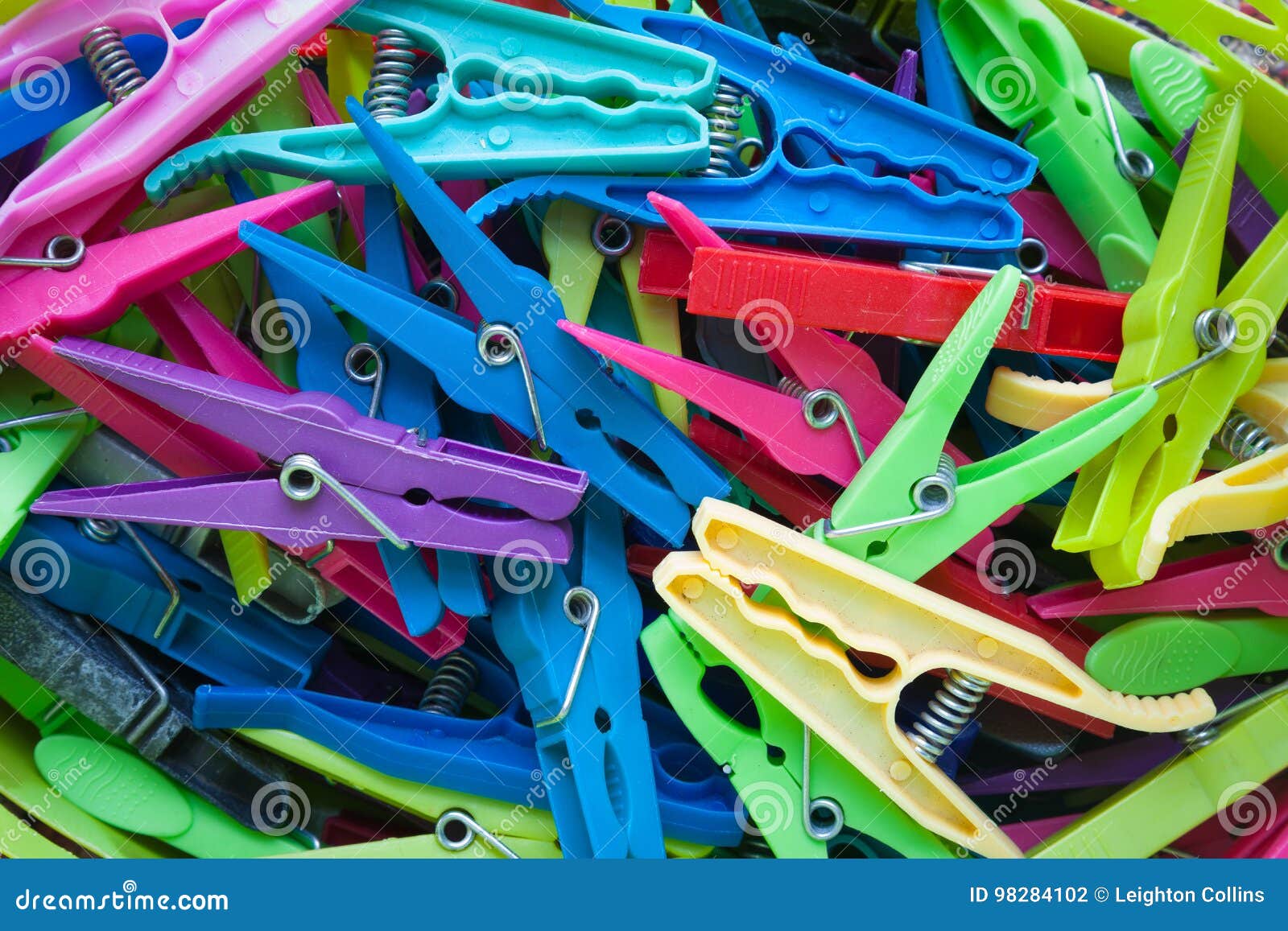 Plastic clothes pegs stock photo. Image of assorted, fastener 98284102