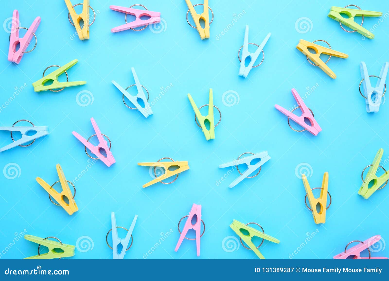 Plastic Clothes Pins on a Blue Background Stock Image Image of