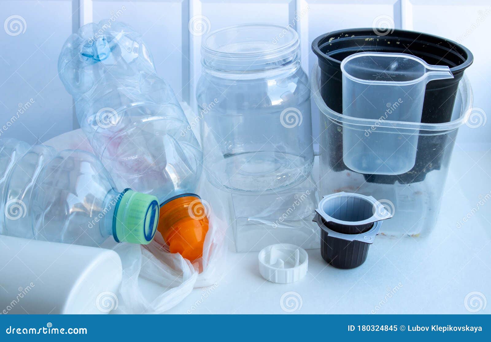 plastic containers on a white background. the processing of plastics. reusable packaging. disaster of the planet. garbage is