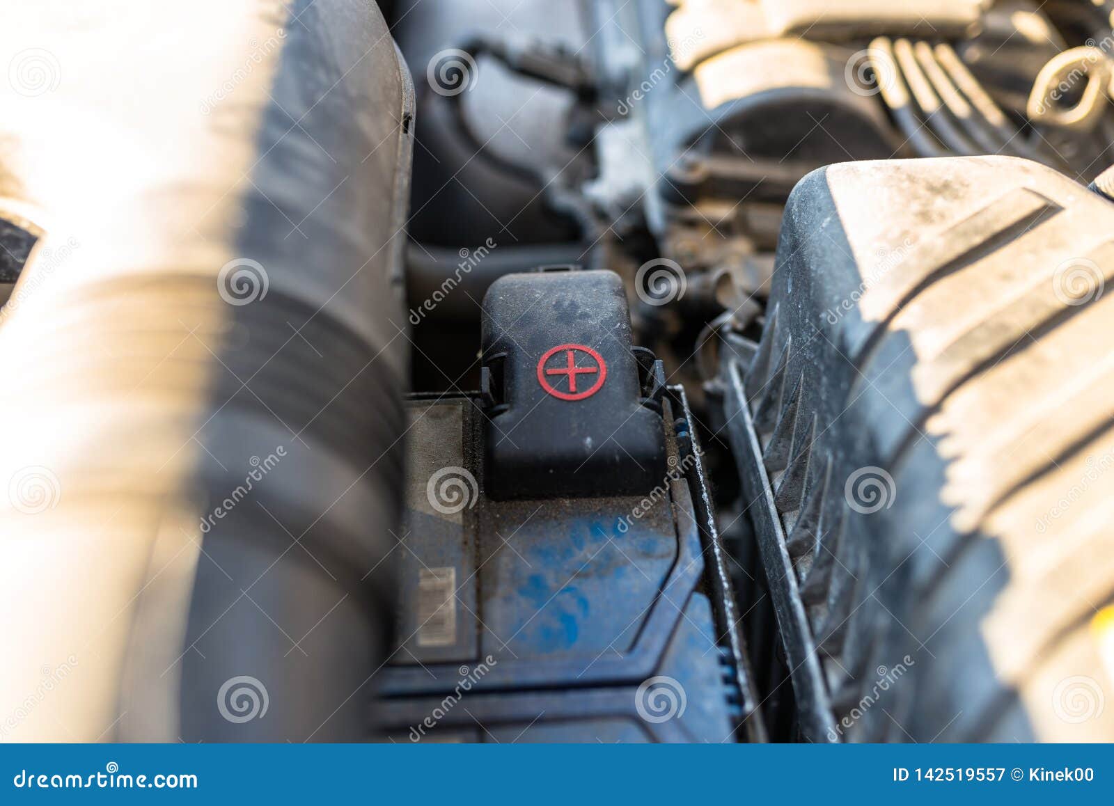 The Plastic Cover of the Positive Battery Cell Tip with the Red Plus