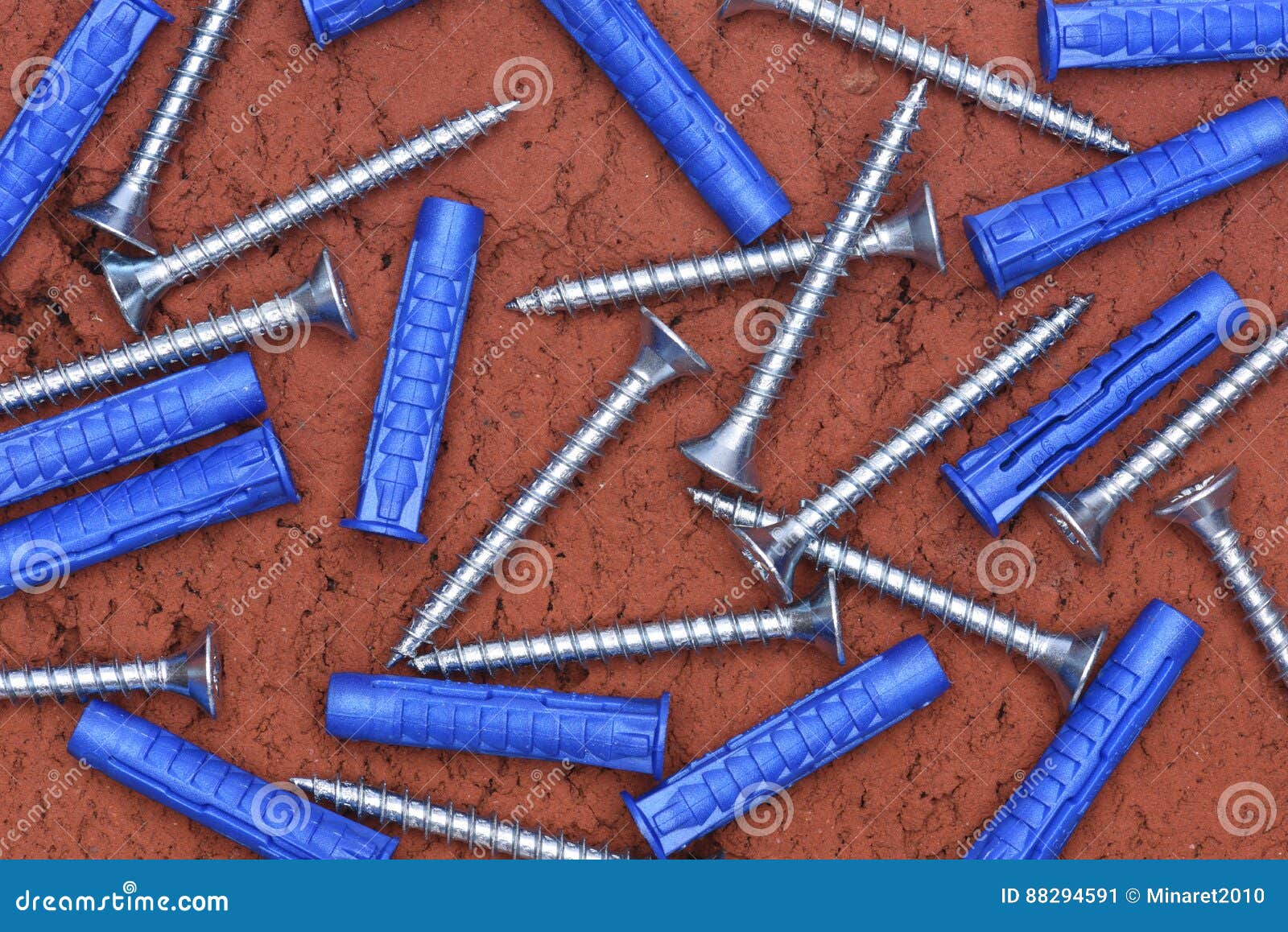 Plastic Dowels Ans Screws on Red Brick Background Stock Image Image