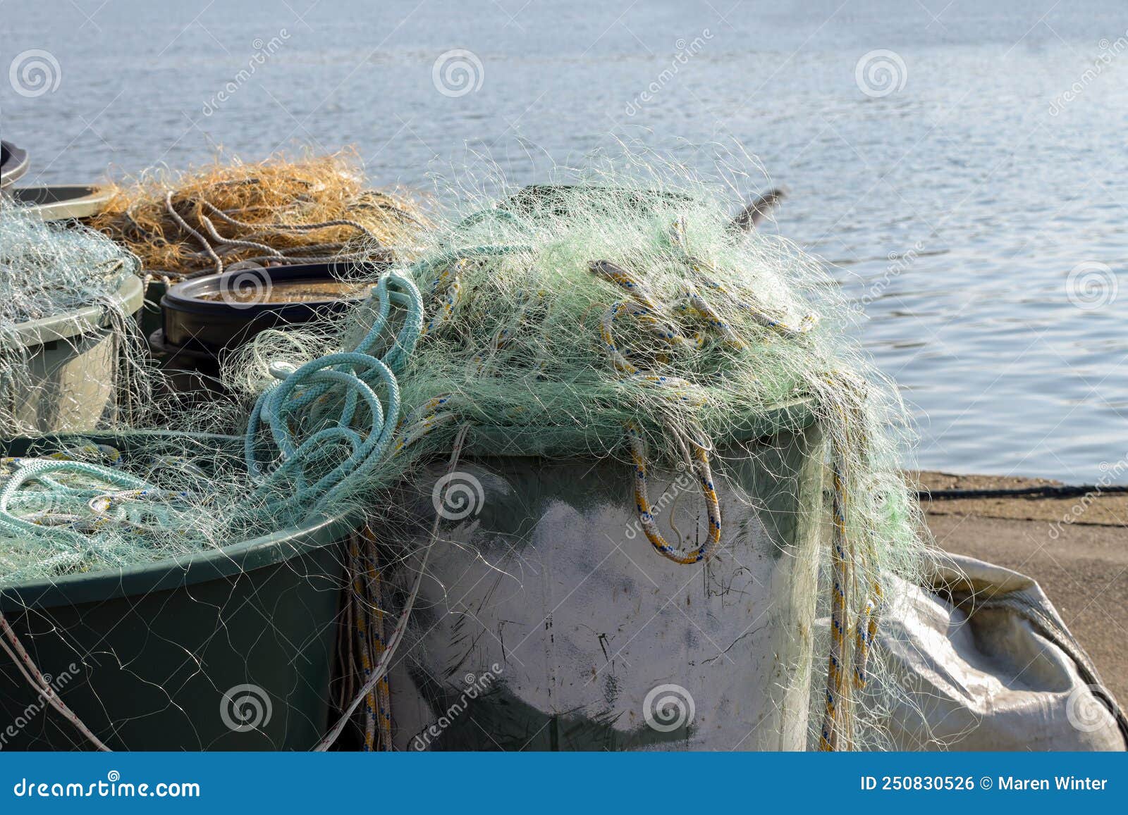 Plastic Fishing Nets in Large Vats on the Quay in the Port on the