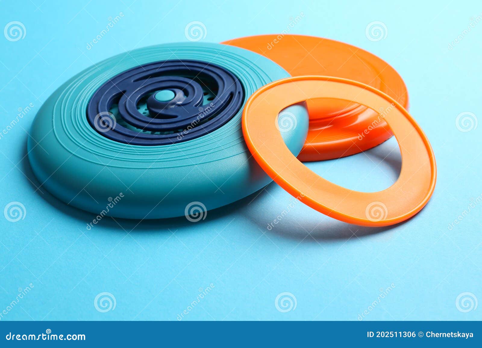 Plastic Frisbee Disks and Ring on Light Blue Background Stock Photo