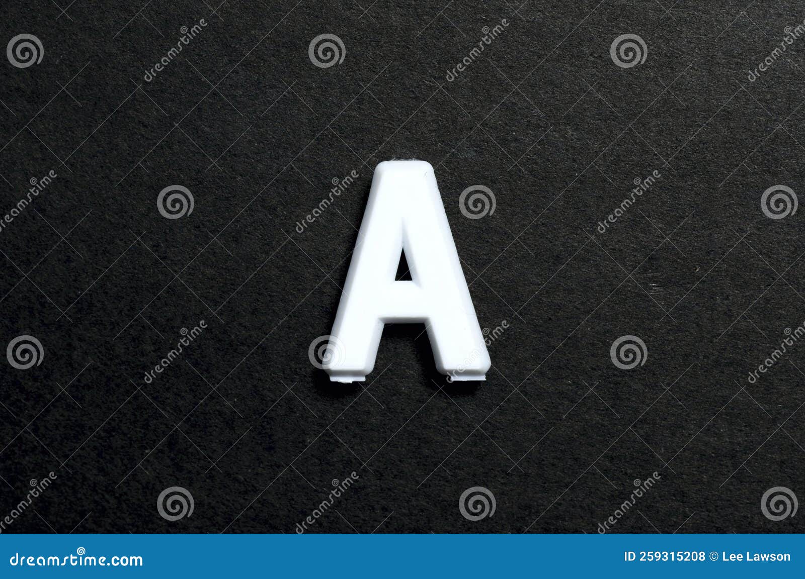 A Plastic Letter a on Black Stock Photo Image of font, education
